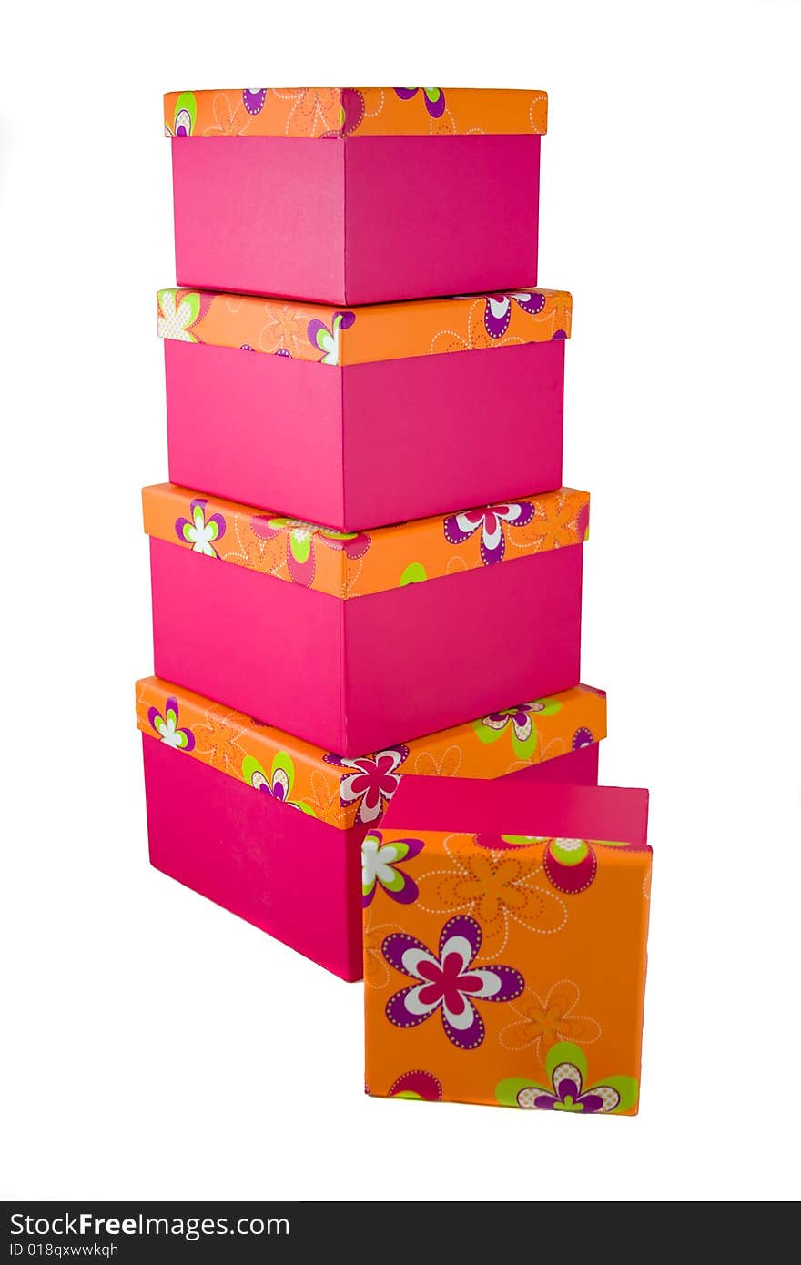 A huge stack of pink with orange flowered top presents. A huge stack of pink with orange flowered top presents.