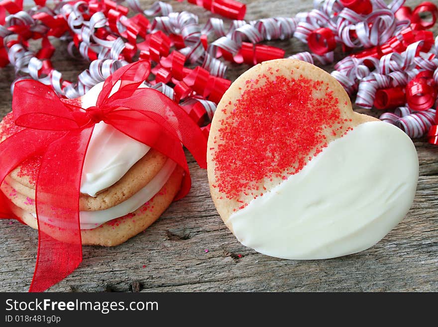 Heart shaped sugar cookies dipped with white chocolate and sprinkles. Heart shaped sugar cookies dipped with white chocolate and sprinkles.