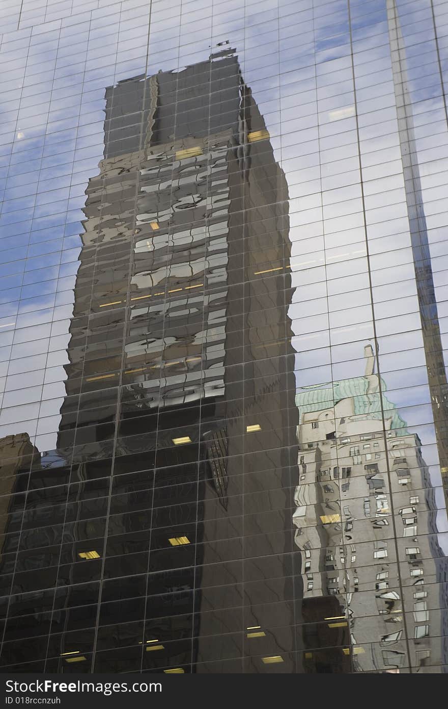 Two buildings reflected on an other at NYC. Two buildings reflected on an other at NYC