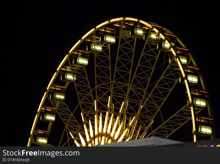 Bright, colorful, ferris wheel at a fair. Bright, colorful, ferris wheel at a fair