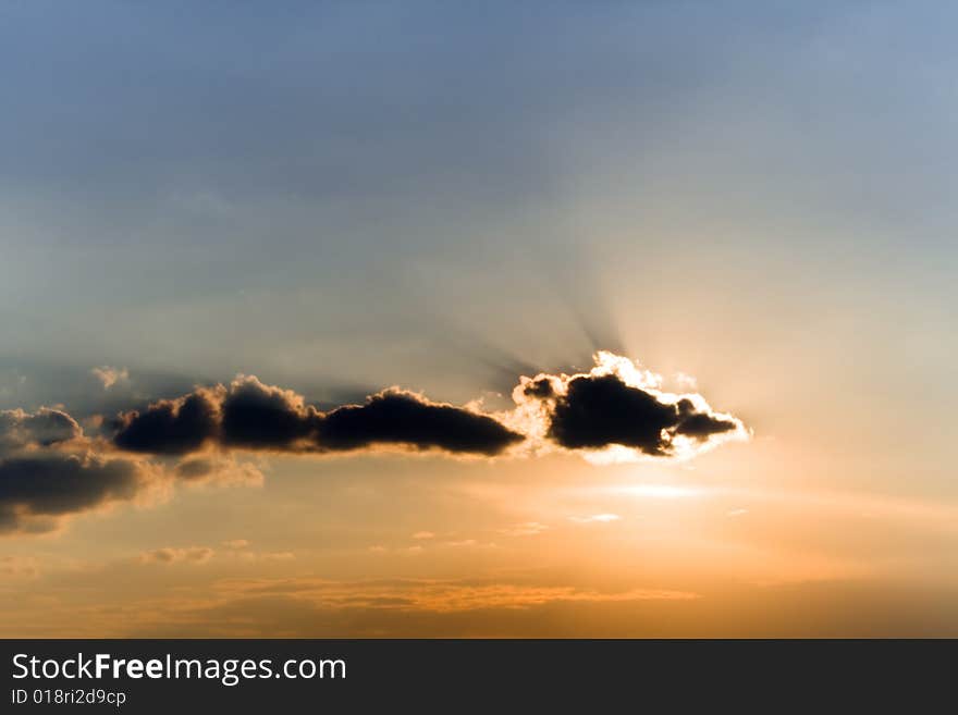 Clouds in sunset beams