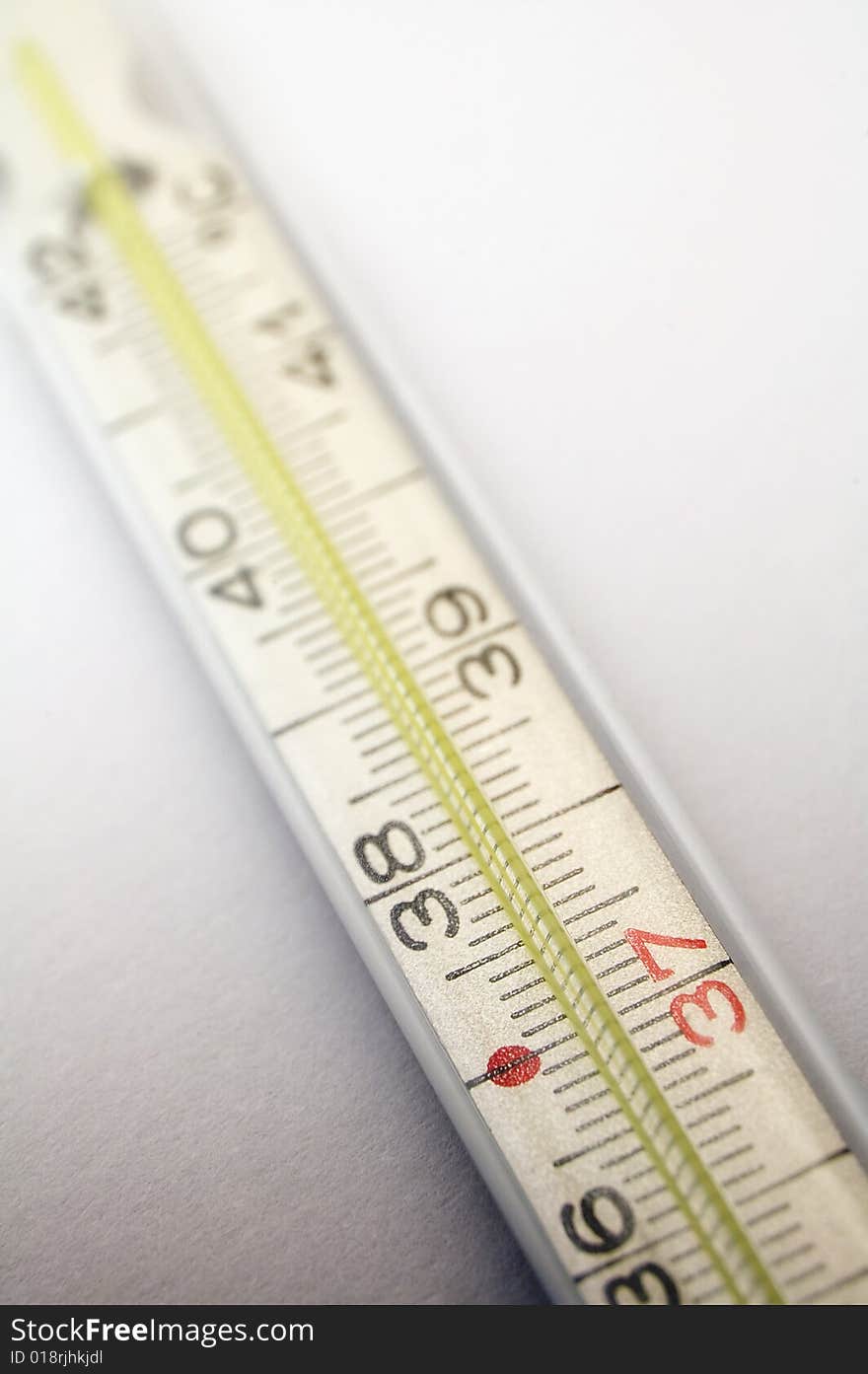 Medical thermometer detail on light grey background