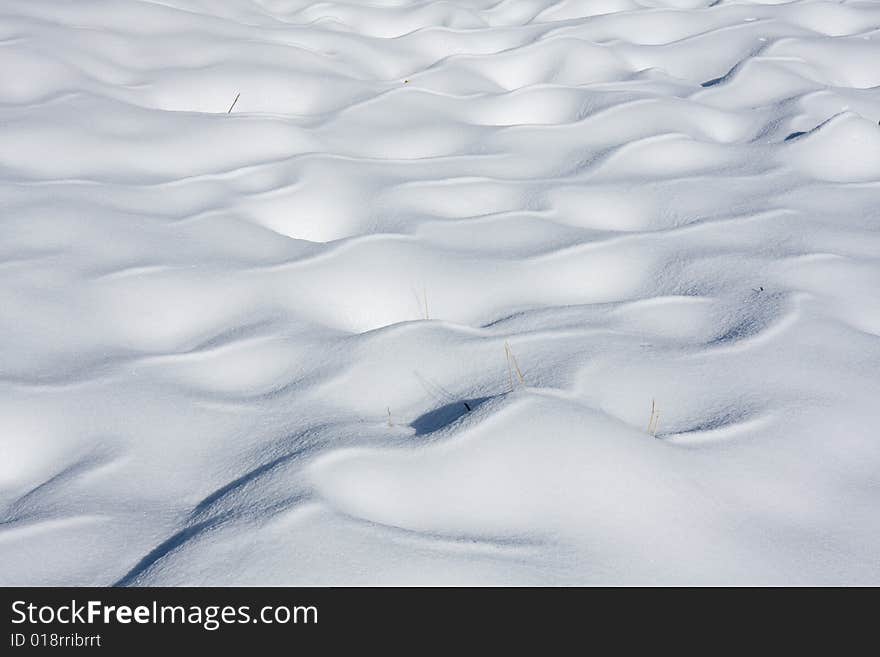 Wavy snow cover in Swiss Alps. Wavy snow cover in Swiss Alps.