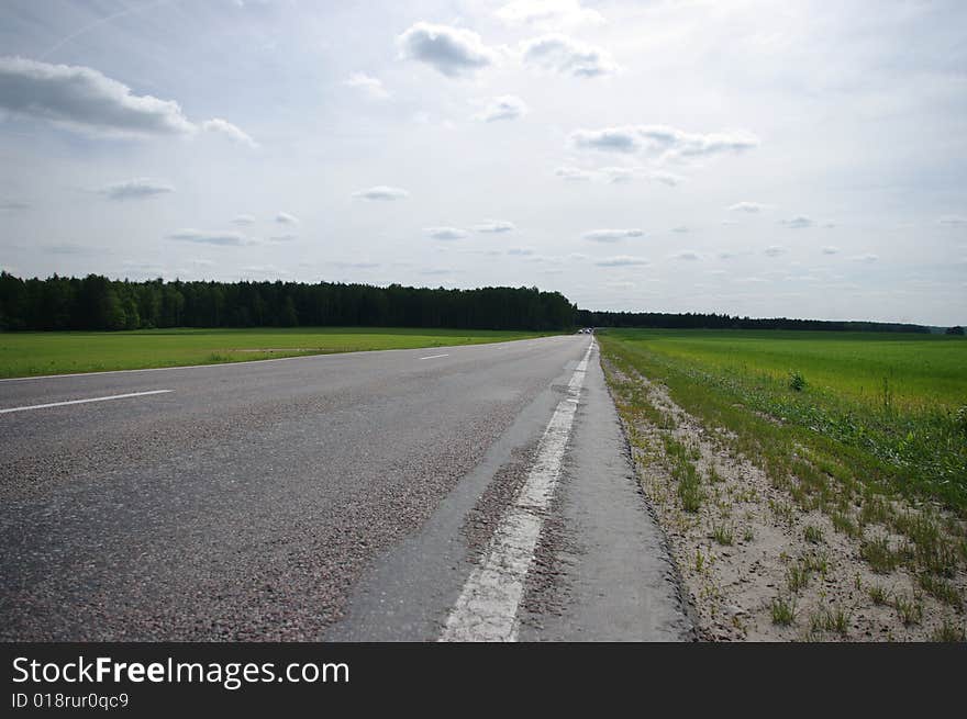 The rural road on a clear summer day. The rural road on a clear summer day.