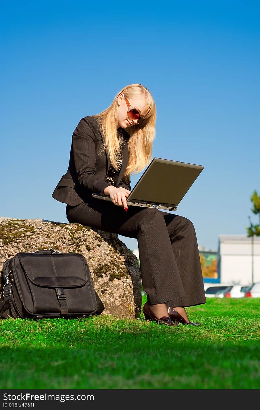 Businesswoman working on laptop