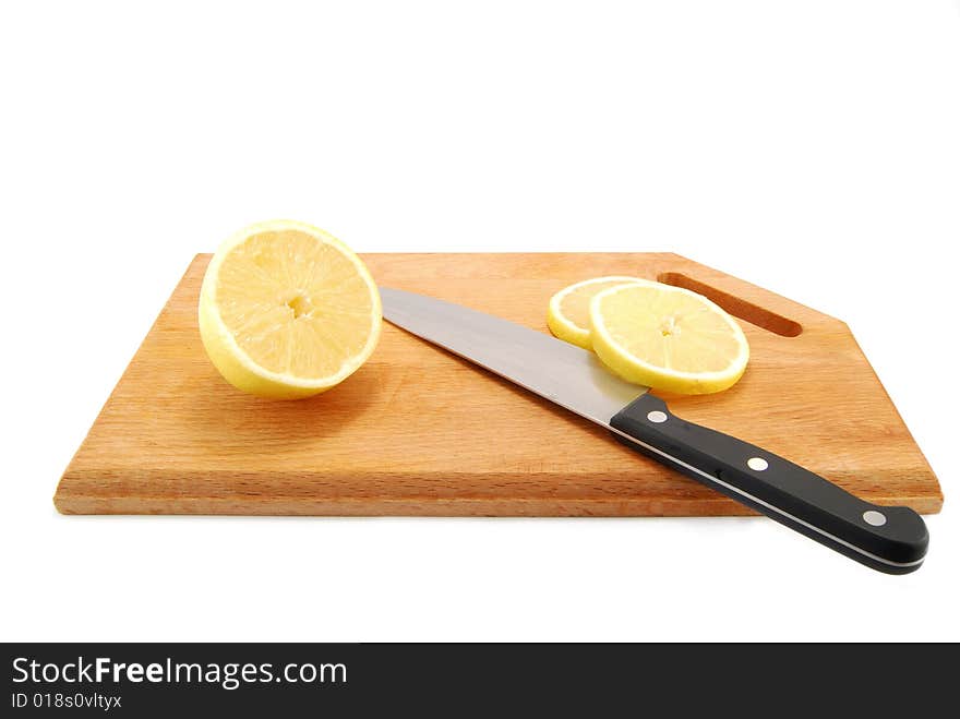 Lemon slices hardboard and knife. Lemon slices hardboard and knife