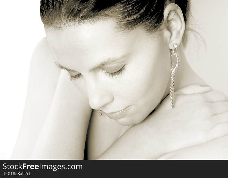 Portrait of a pretty, young woman on a white background. Portrait of a pretty, young woman on a white background.