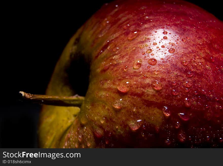 Close up of an apple isolated on black background. Close up of an apple isolated on black background