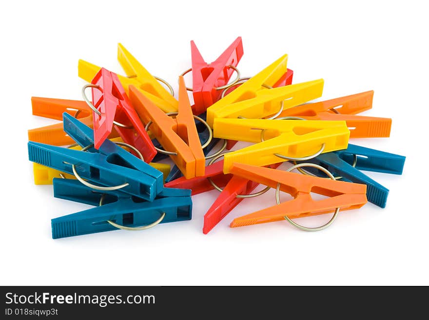 Heap of clothespins isolated on white background