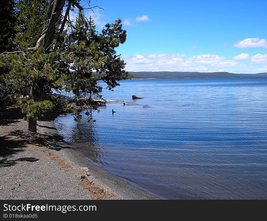 Huge volcanic lake with blue sky and white clouds. Huge volcanic lake with blue sky and white clouds.