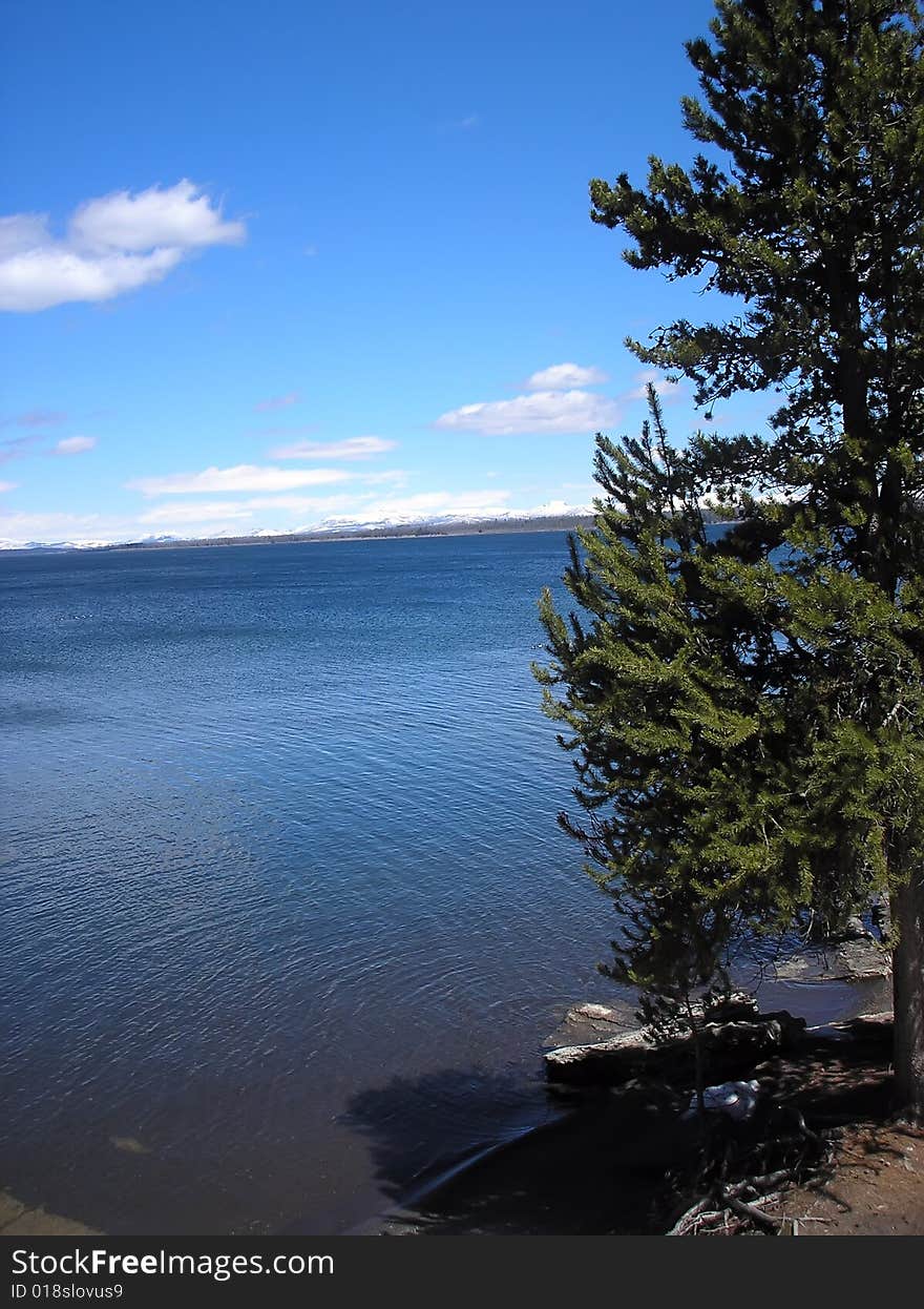 Huge volcanic lake with blue sky and white clouds. Huge volcanic lake with blue sky and white clouds.