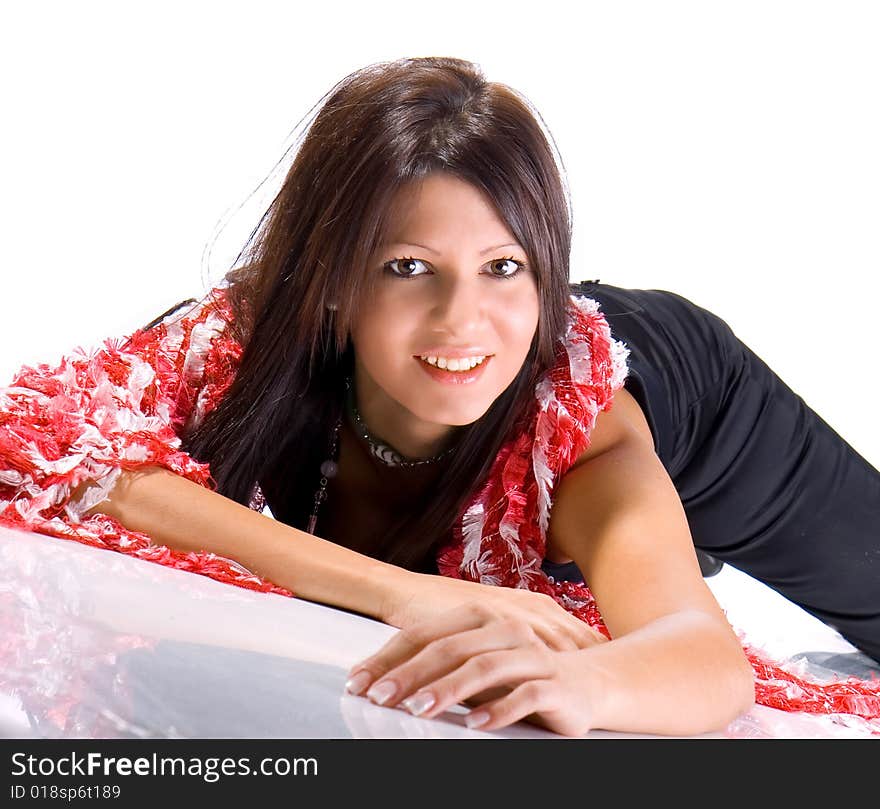 Beautiful young woman laying on floor smiling. Shot in studio over white.