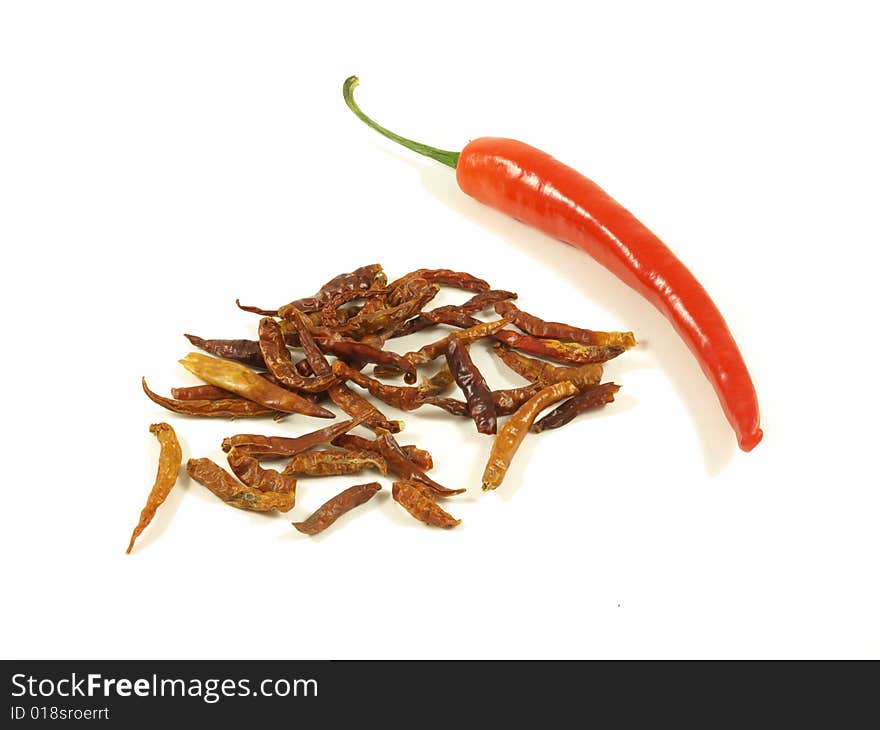 Chili with dried chili pieces on white isolated background. Chili with dried chili pieces on white isolated background.