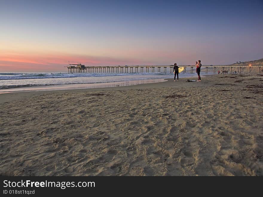 Surfer at Sunset, La Jolla shores, San Diego, California