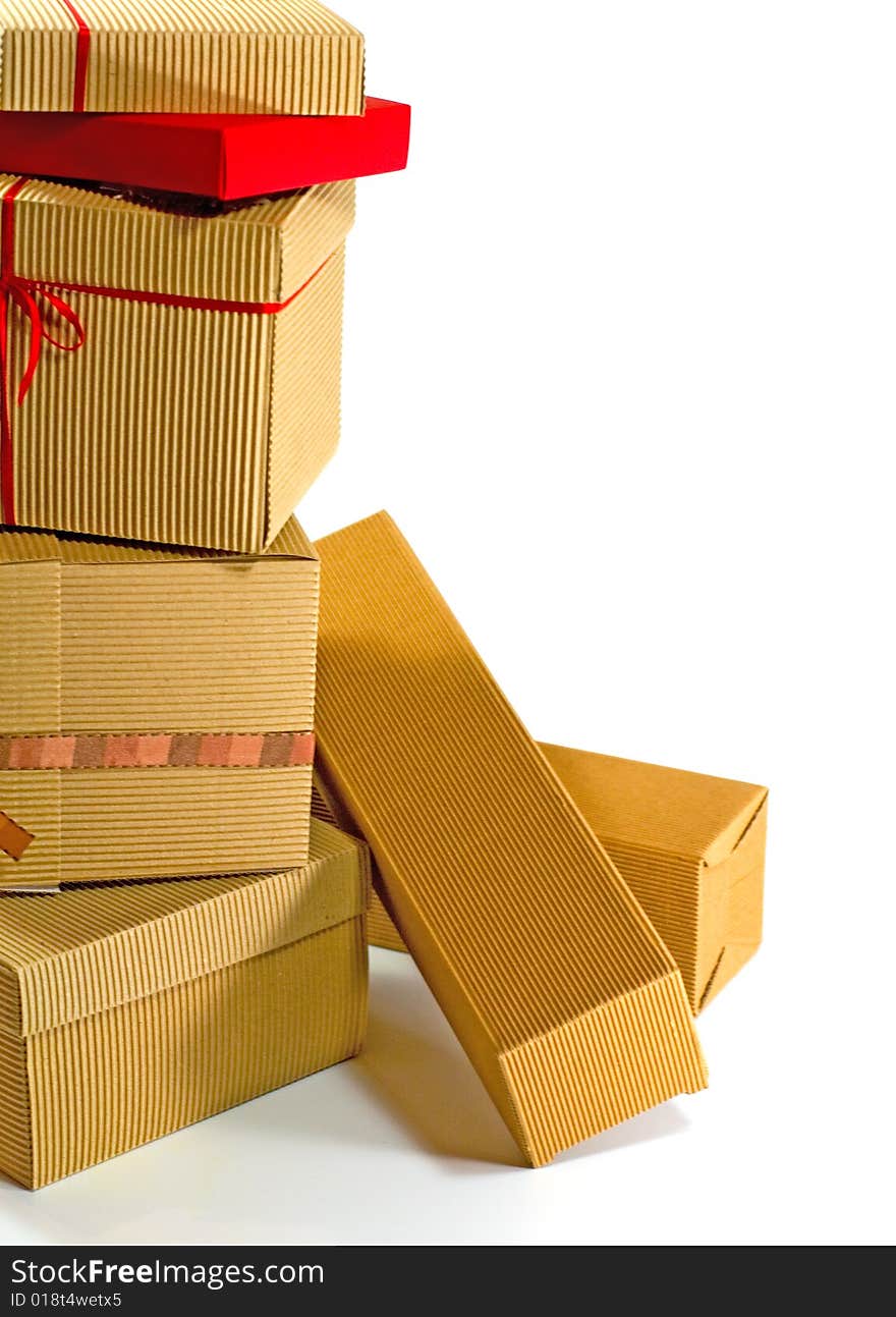 Stack of cardboard boxes close up on white background