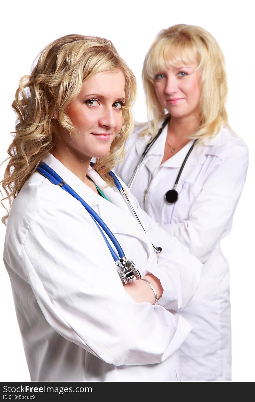 Friendly young doctors smiling over a white background