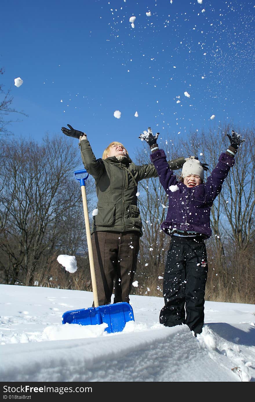 Mother and her daughter on a winter background