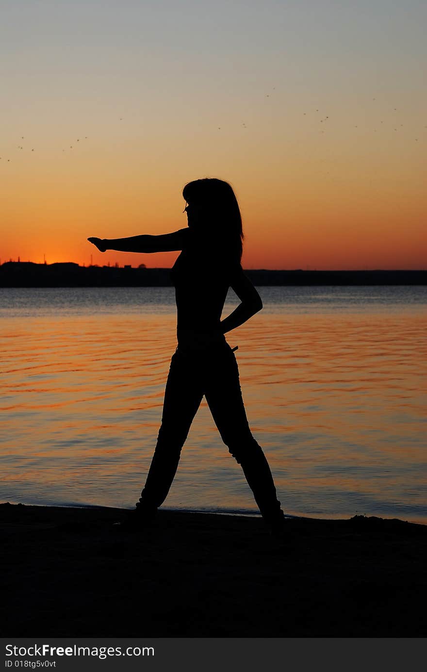 Girl doing exercises on the beach. Girl doing exercises on the beach