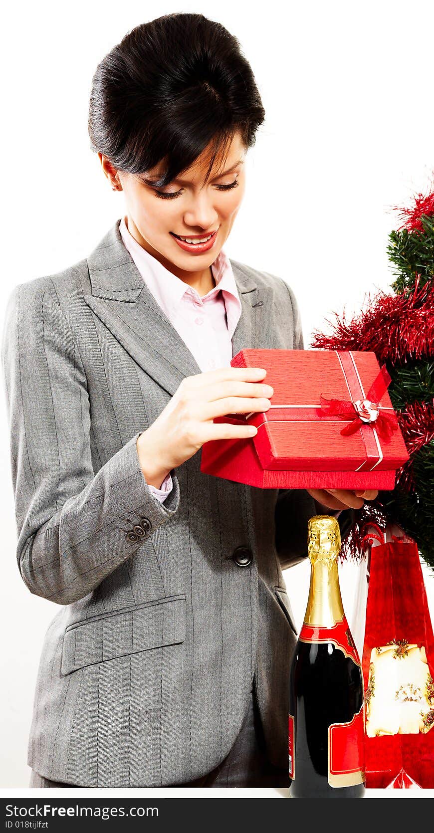 Young cute caucasian woman with red gift over white