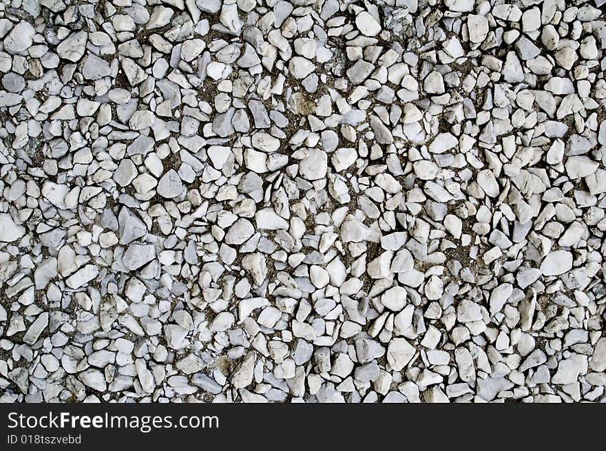 Background of a wall of white and gray rocks. Background of a wall of white and gray rocks