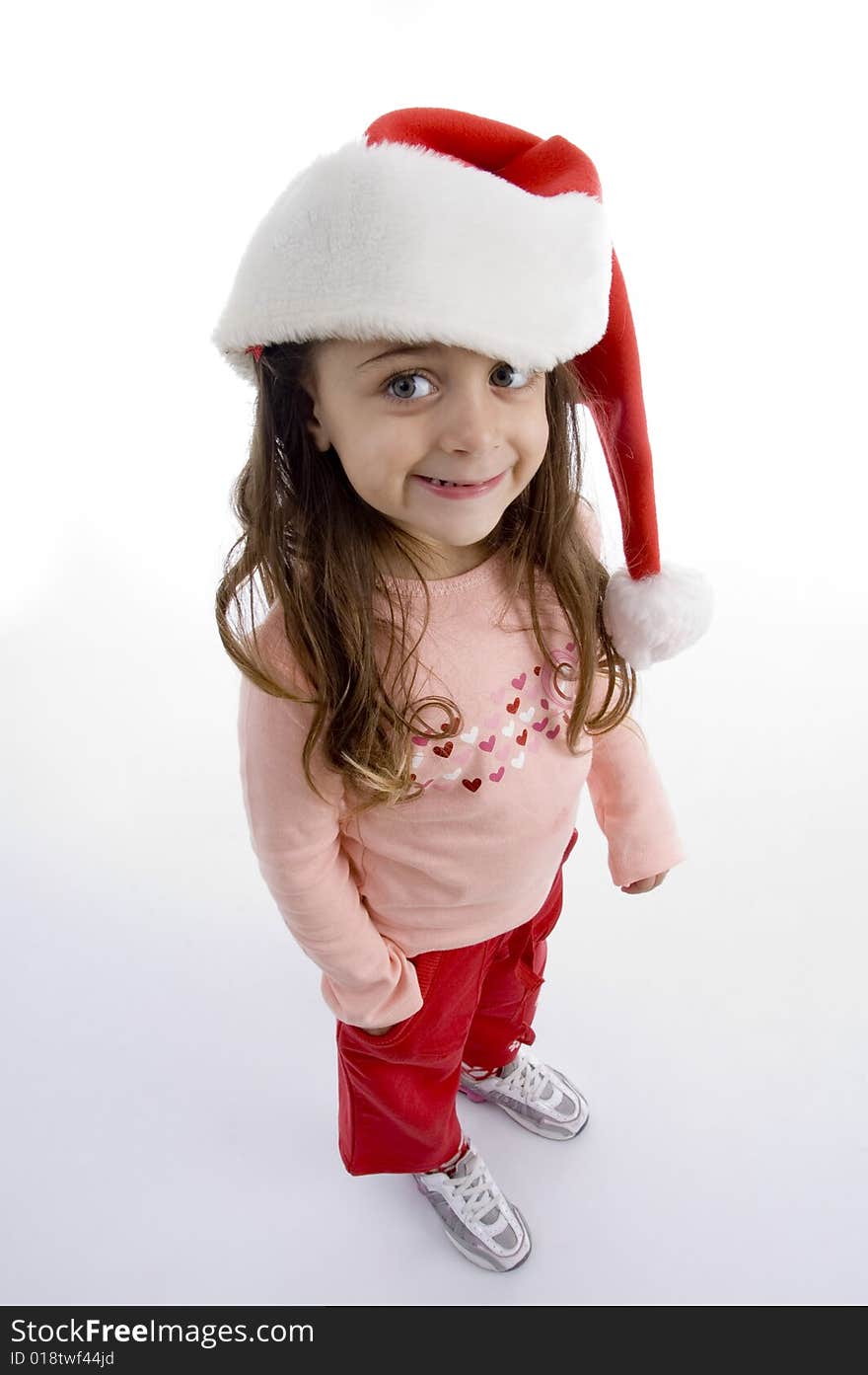 Standing little girl with christmas hat with white background