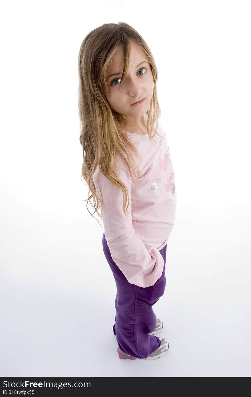 Side pose of little girl on an isolated background