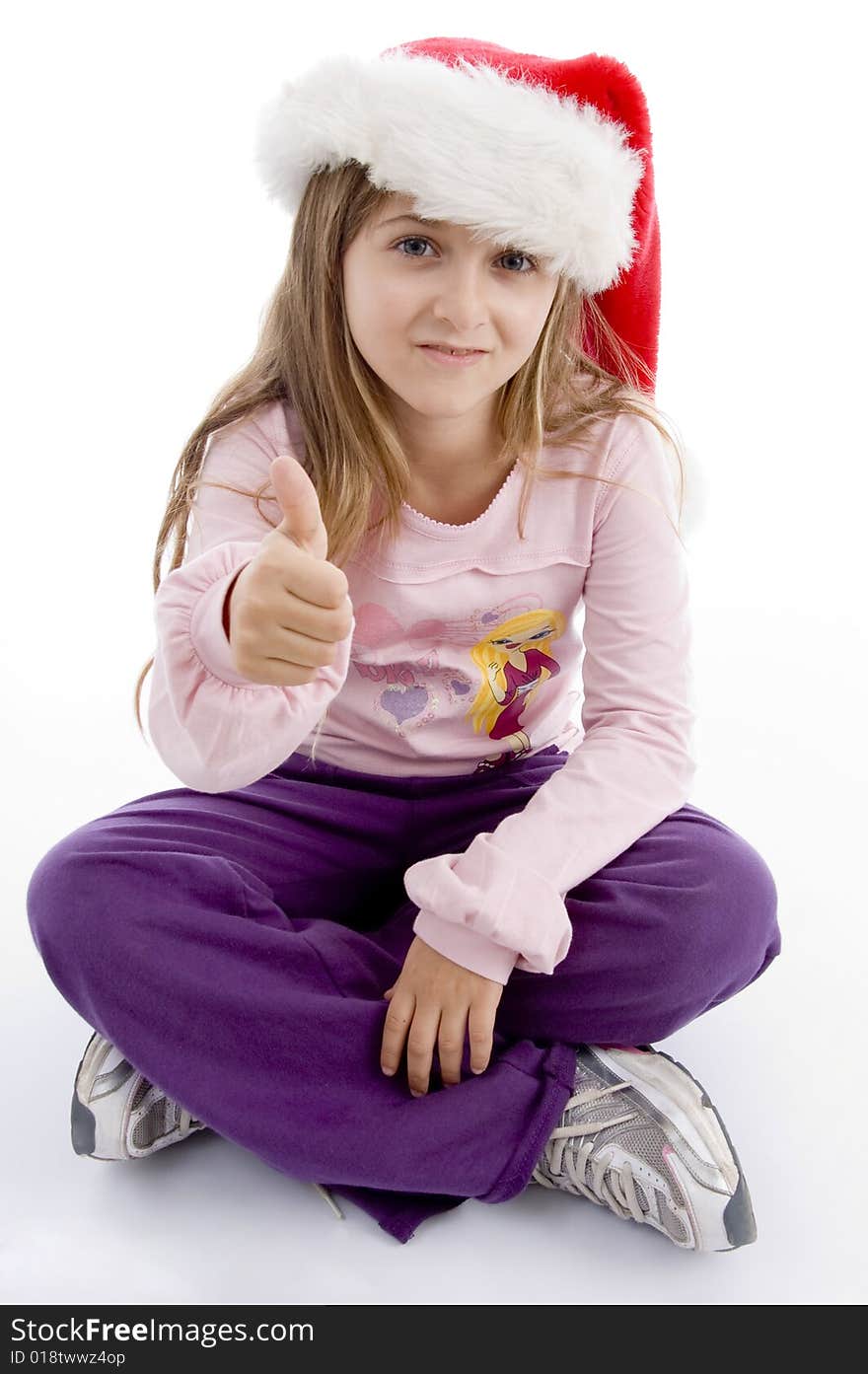 Sitting cute girl wishing goodluck on an isolated background