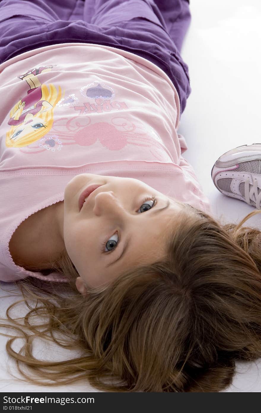 Little blond girl looking at camera on an isolated white background. Little blond girl looking at camera on an isolated white background