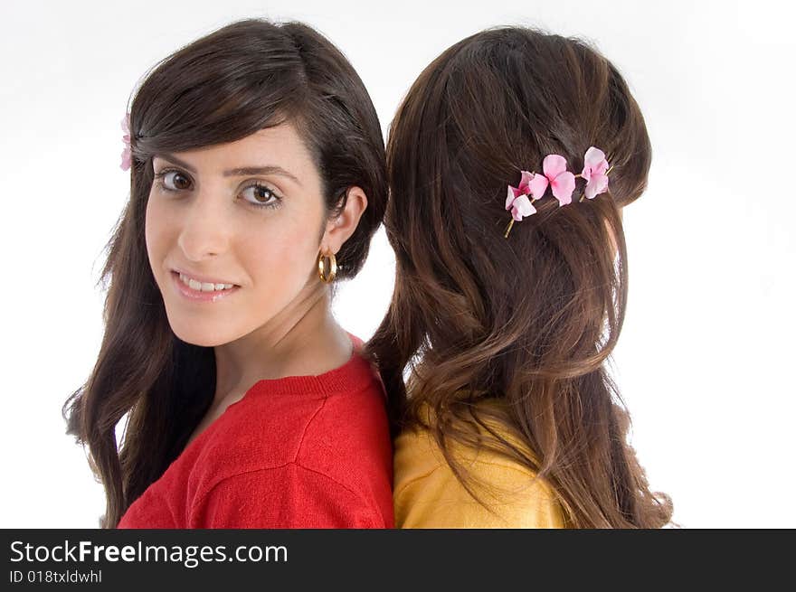 Portrait of brunette sisters on an isolated white background