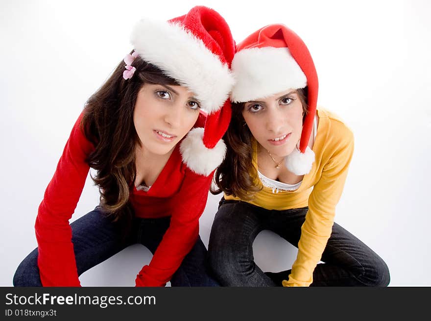 Sitting females with christmas hat on an isolated background