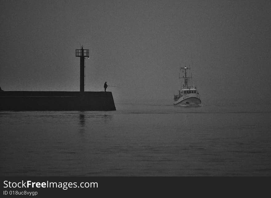 Ships entering the port during fog. Noise imitate the film and film are intentional. Ships entering the port during fog. Noise imitate the film and film are intentional.