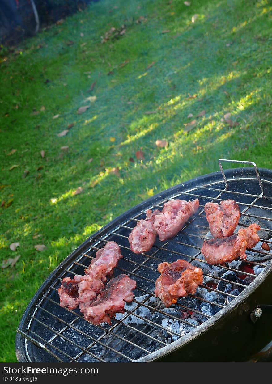 Cooking sausages on the barbeque