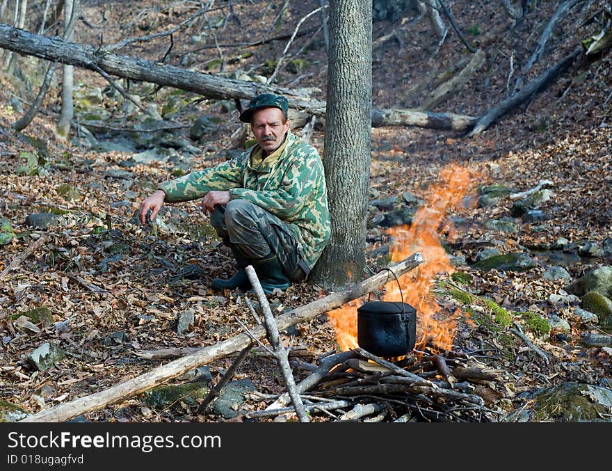 Man at Bonfire 1