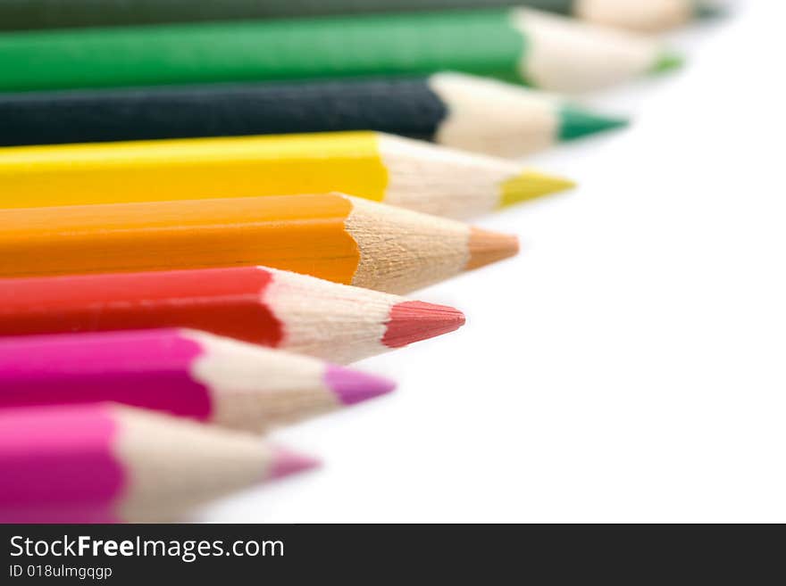 Line of colorful pencils isolated on white