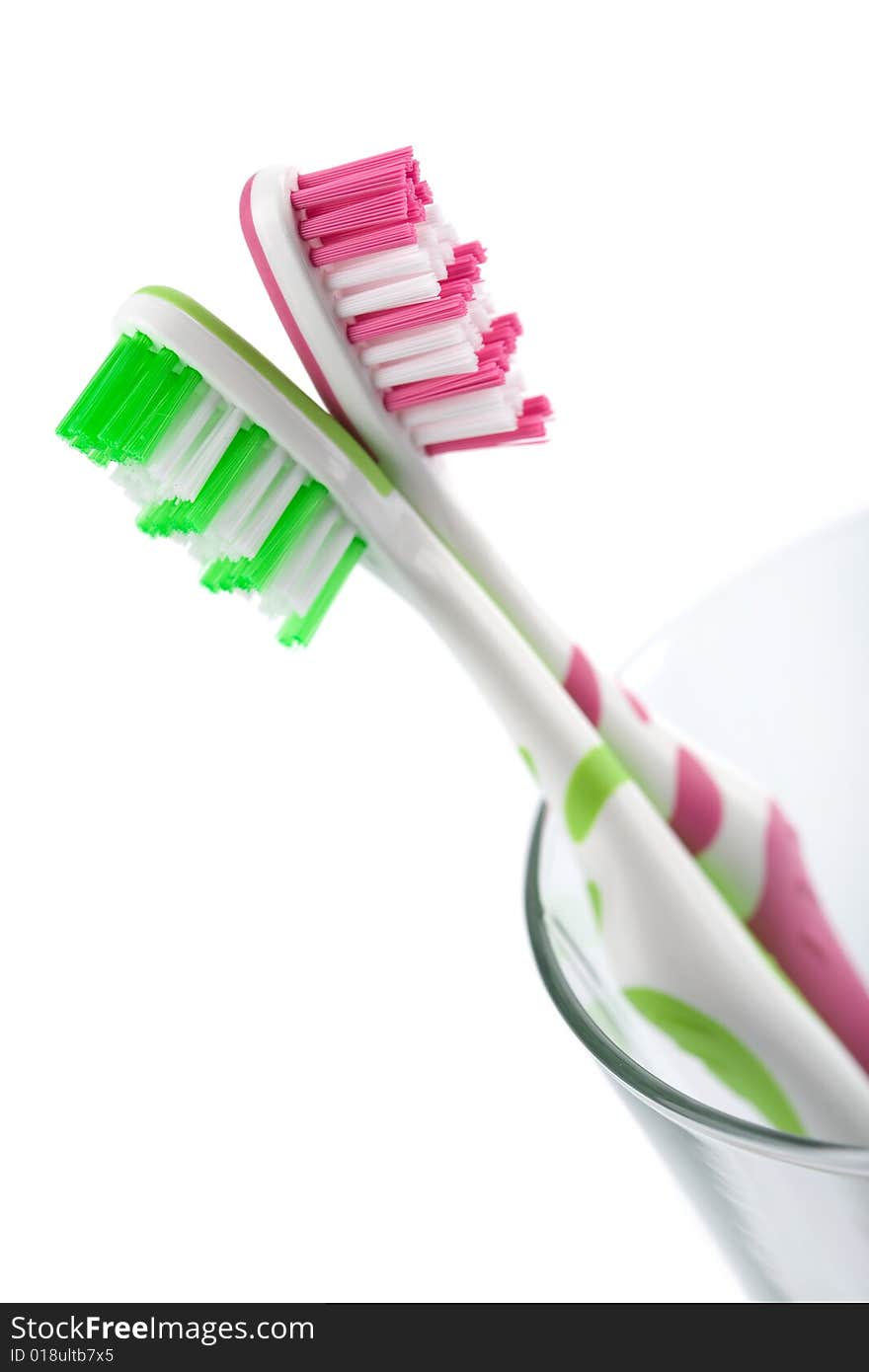 Two colorful toothbrushes isolated