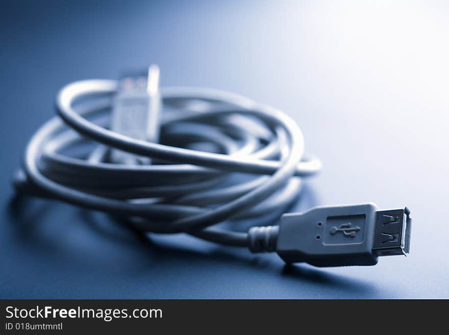 Usb cable toned blue. computer background