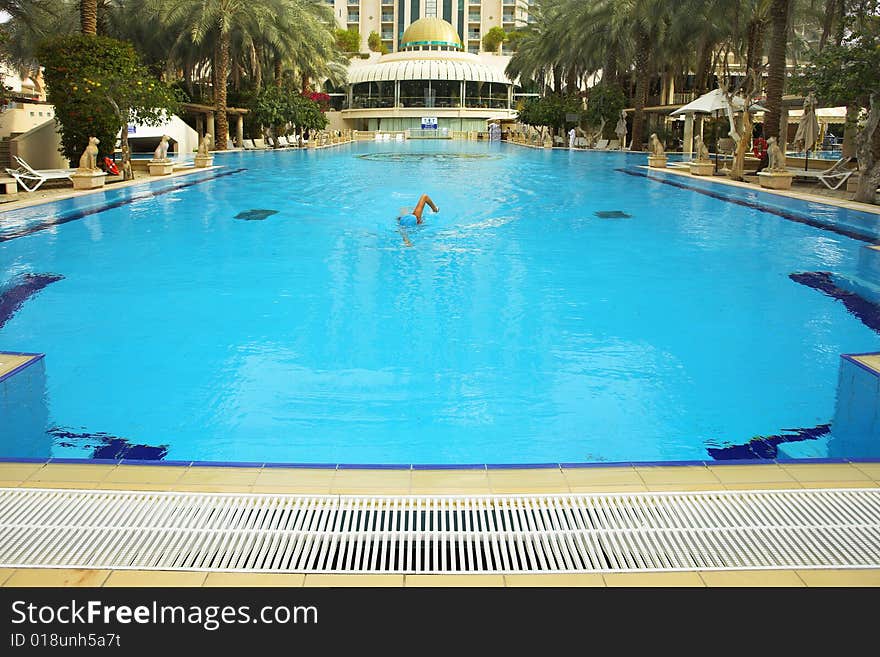 The first morning heat on training sportswoman in pool of magnificent hotel. The first morning heat on training sportswoman in pool of magnificent hotel