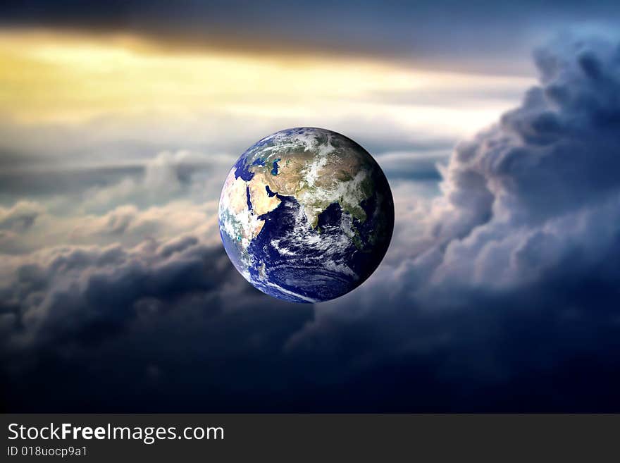 Planet earth in a cloudy sky