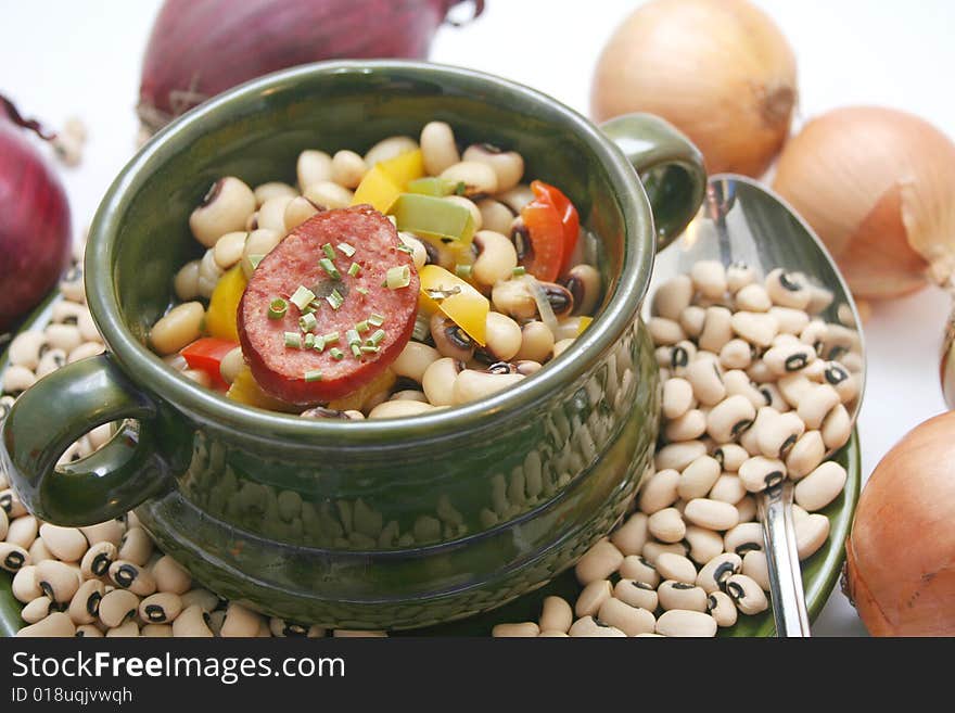 A stew of fresh beans, vegetables and sausages. A stew of fresh beans, vegetables and sausages