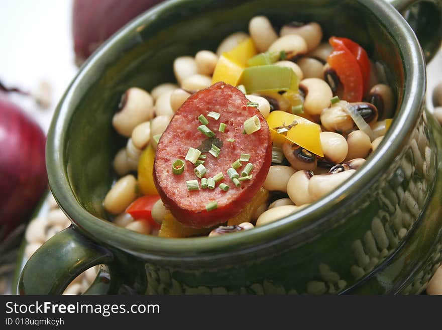 A stew of fresh beans, vegetables and sausages. A stew of fresh beans, vegetables and sausages