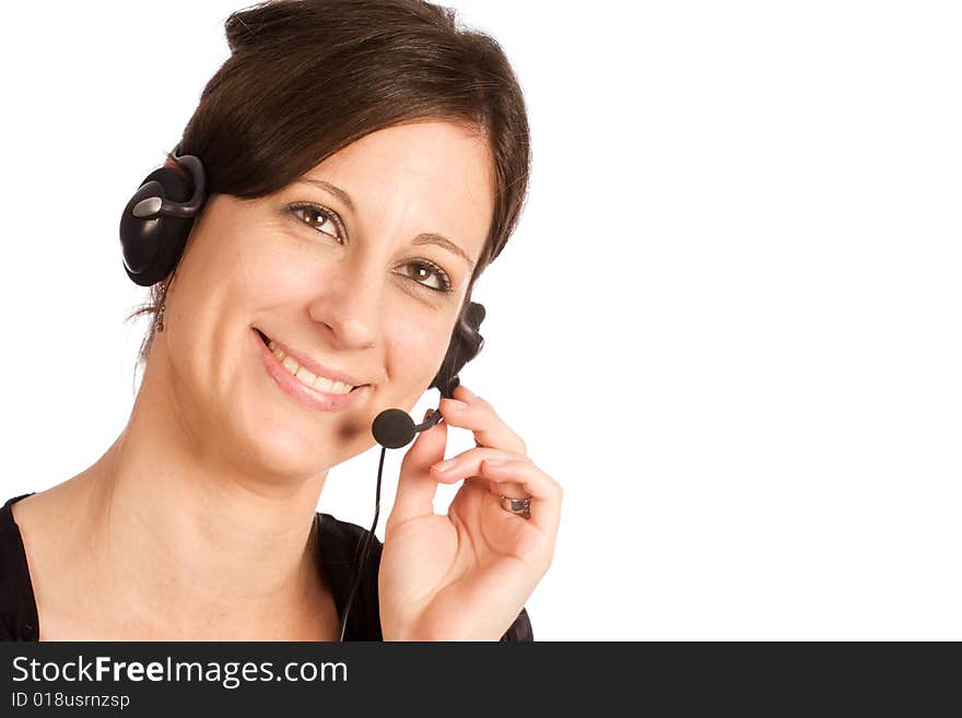 Young friendly Caucasian brunette woman with headset, smiling during conversation and looking up. Young friendly Caucasian brunette woman with headset, smiling during conversation and looking up