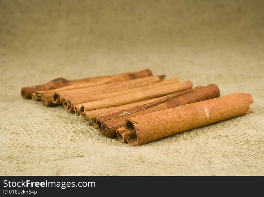 Whole cinnamon sticks on burlap