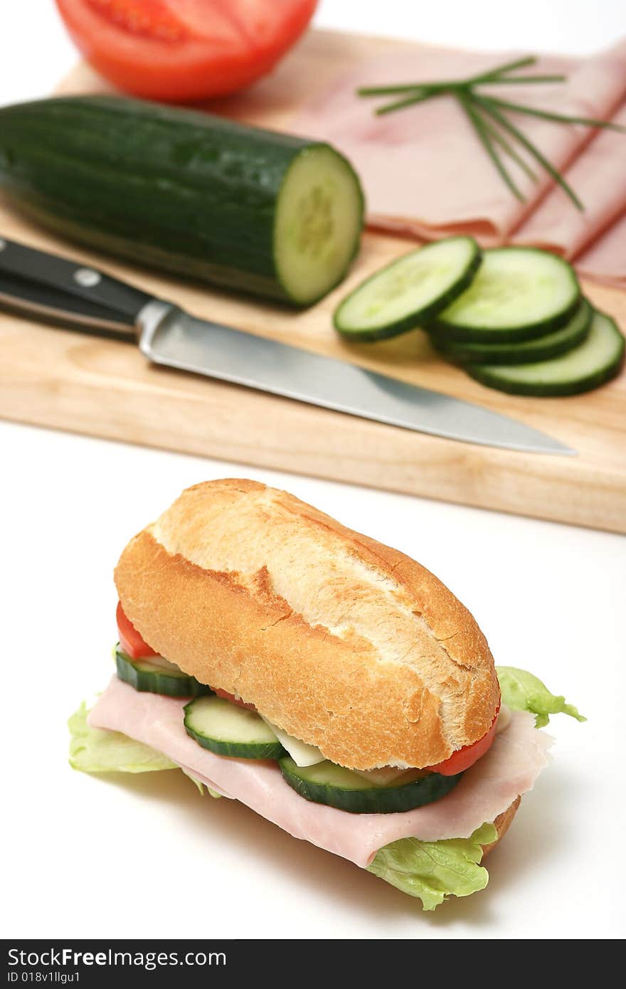 Ham,tomato,cucumber and salad sandwich isolated on white