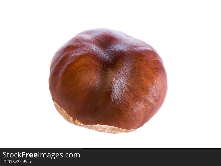 A few brown chestnuts are on a white background