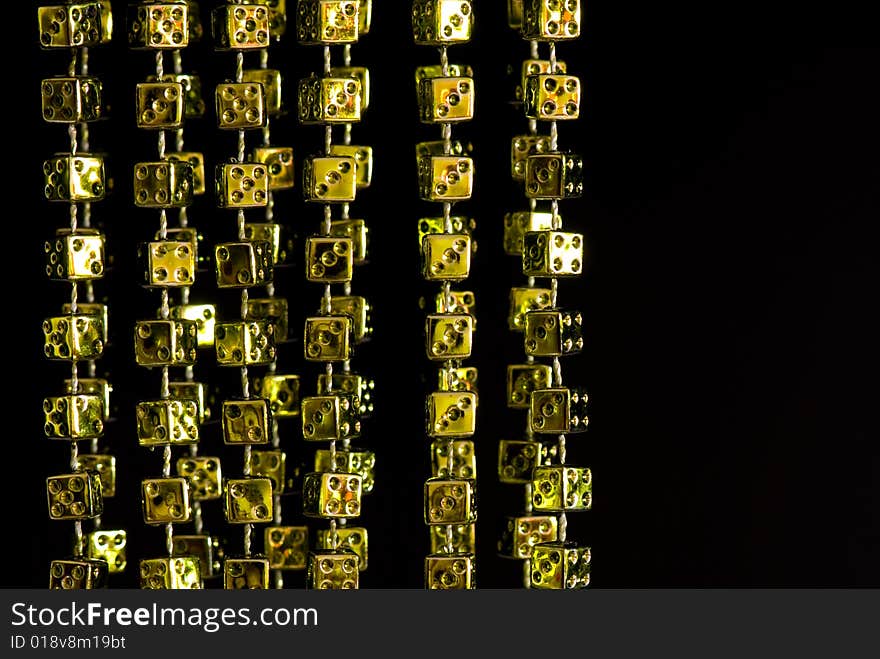 Garland from yellow playing bones on the isolated background