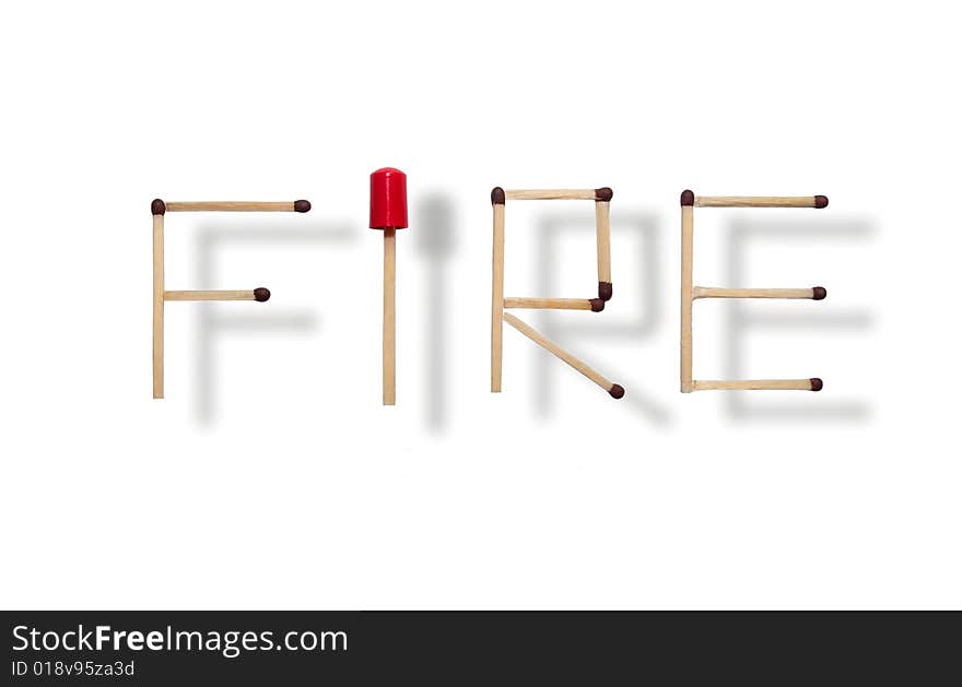 Word fire made of individual matches put together on white background and a red cap giving a sense of alertness