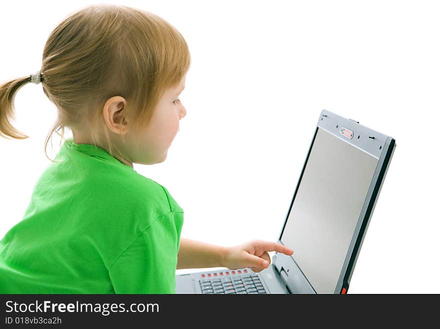 Child with laptop show finger in screen on white background