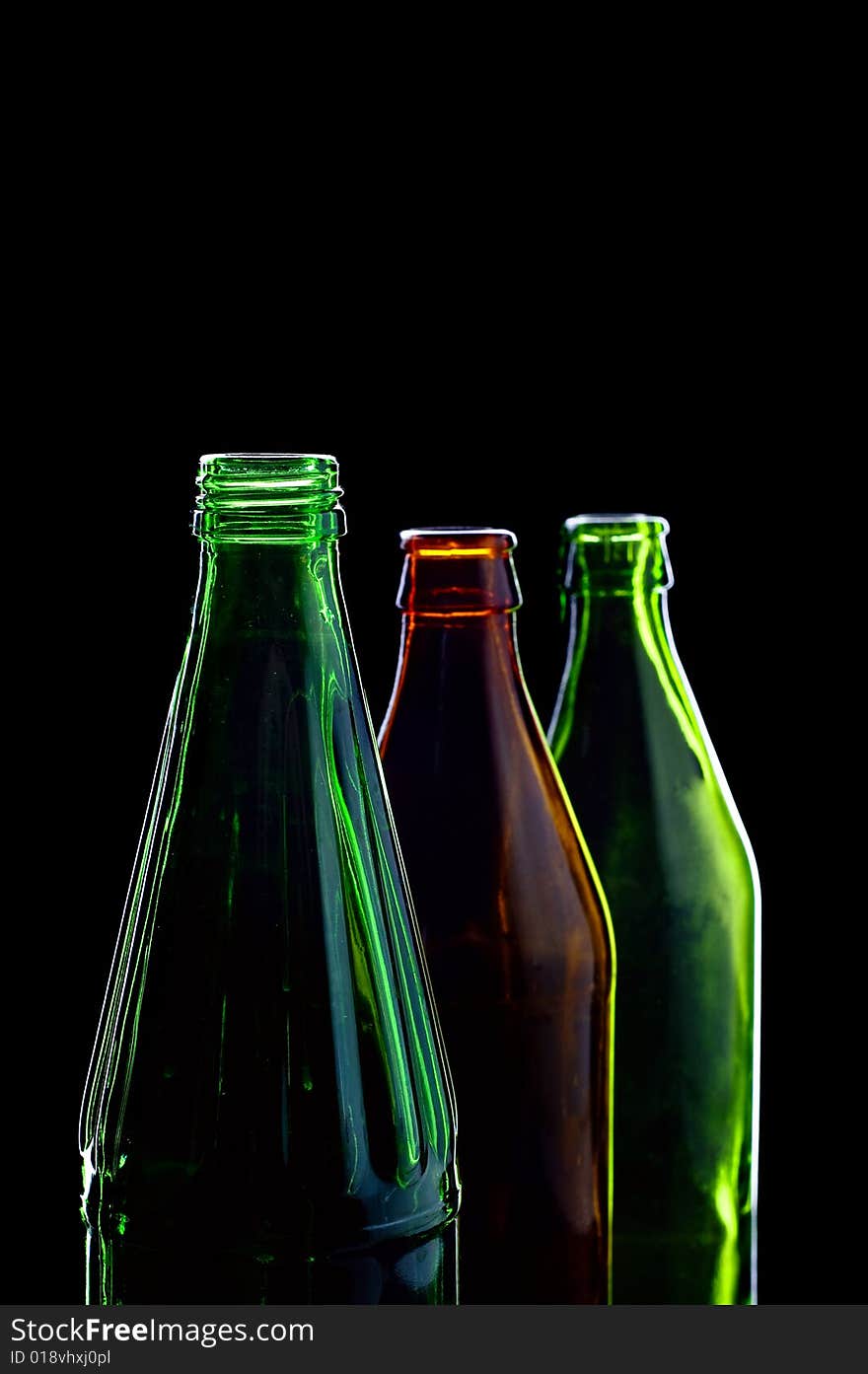 Close-up empty bottles isolated on black