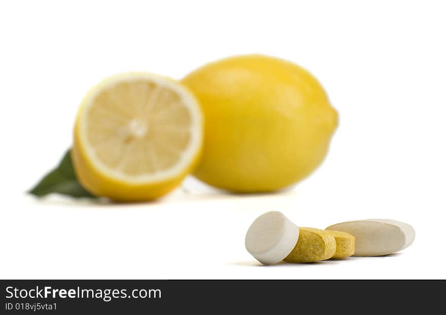 A photo of lemon and pills. A photo of lemon and pills