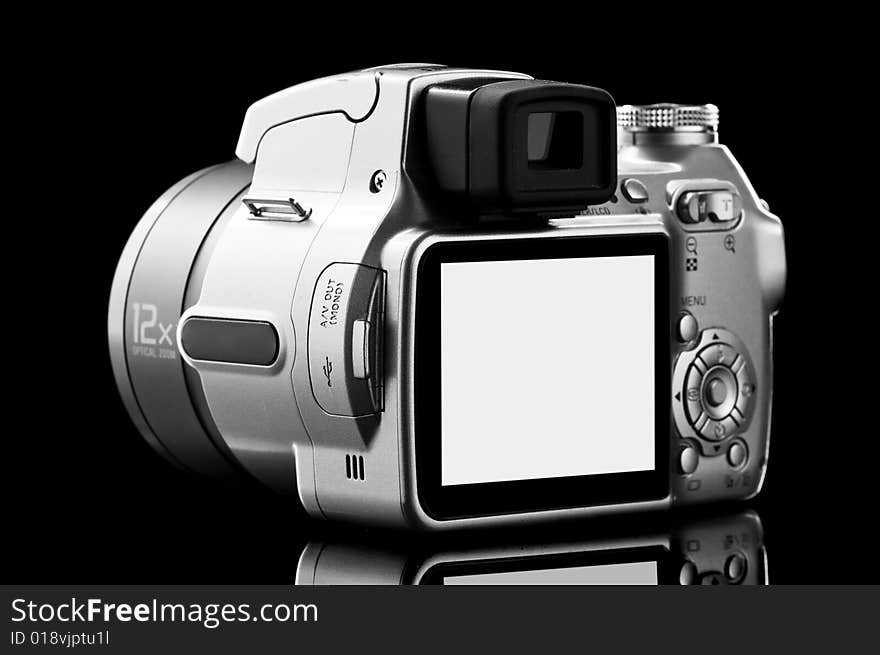 Close-up photo camera isolated on black